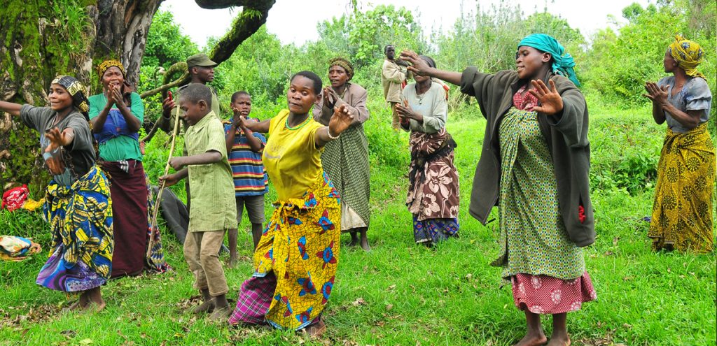 Batwa community performing traditional songs and dances